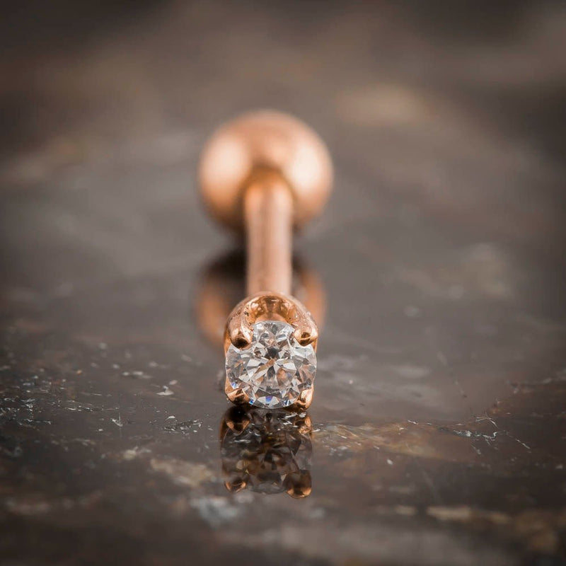 14k rose gold 2mm CZ cartilage stud front-on close-up showing four-prong basket setting detail