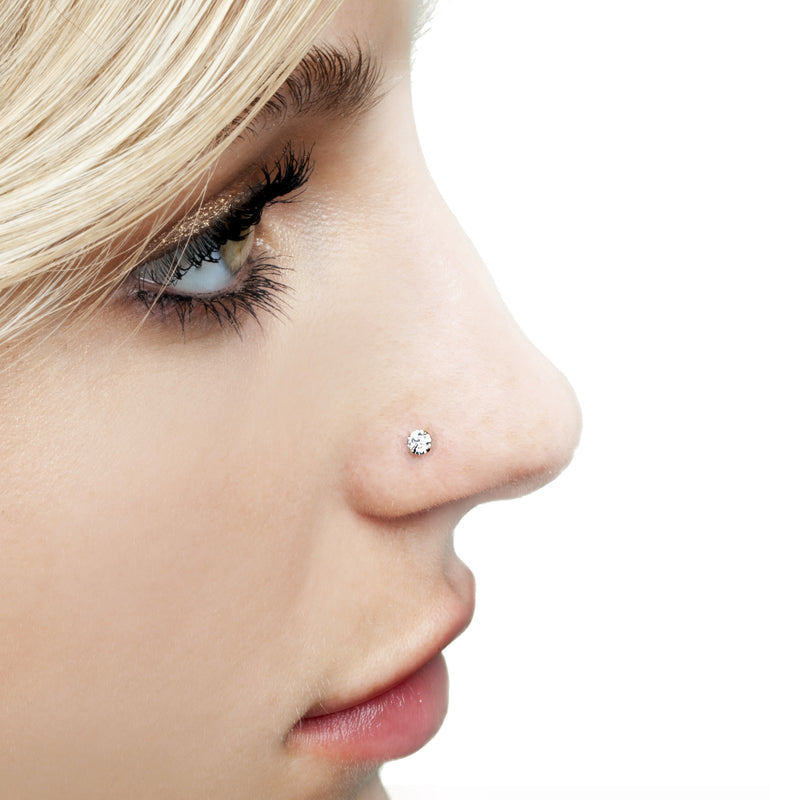 3mm CZ 14k gold nose stud shown in piercing on model, side profile view for fit reference