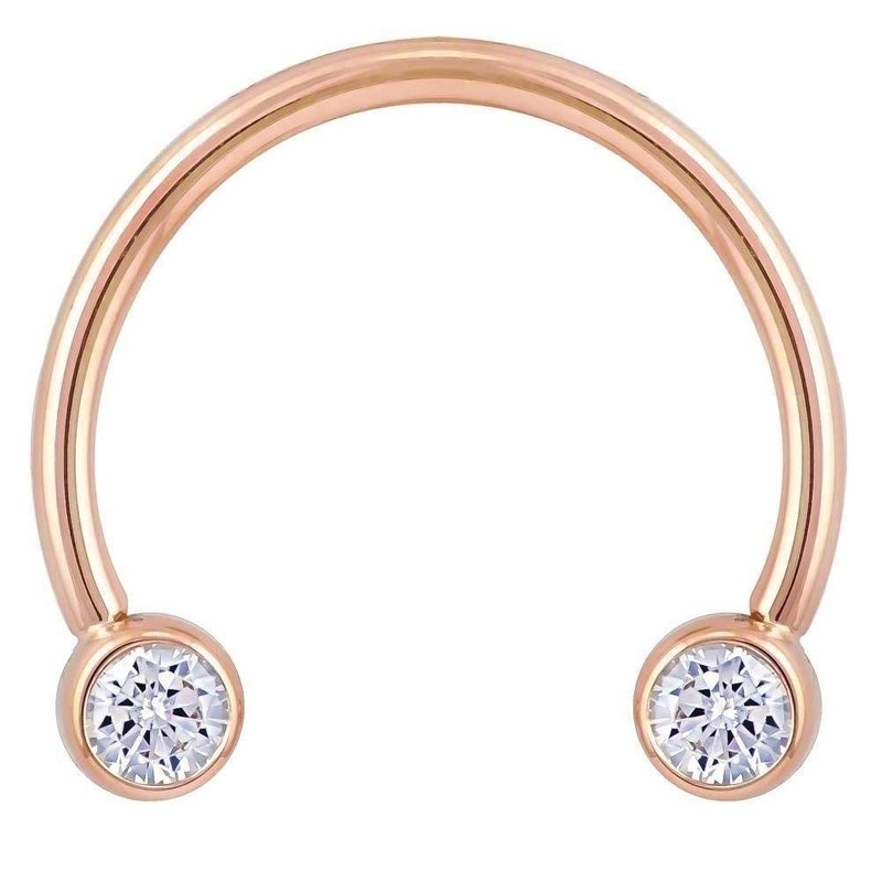 14k rose gold CZ circular barbell with dual bezel ends, 16G front view showing warm pink-gold tone