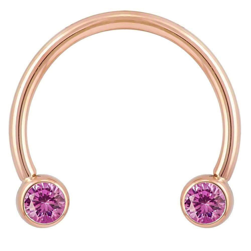 14k rose gold circular barbell with pink CZ bezel ends, smaller diameter showing warm gold tone