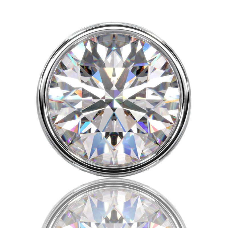 Extreme close-up front view of 3.5mm VS1 diamond in white gold bezel setting, showing full brilliance