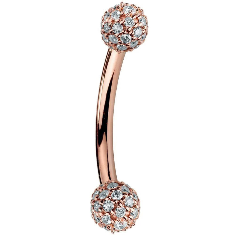 14K rose gold curved barbell with diamond pavé 4mm balls, warm blush tone side profile view