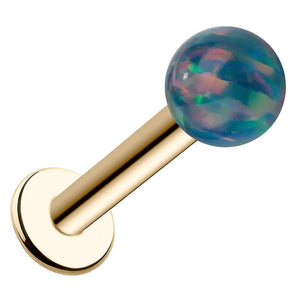 14k yellow gold flat back labret with 5mm iridescent teal synthetic opal ball, angled view