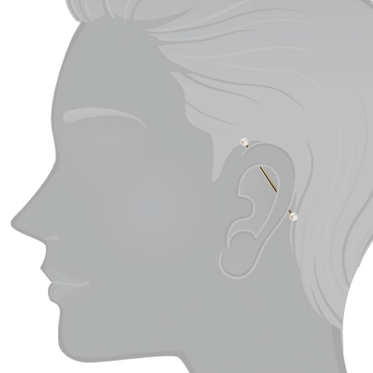 14K gold pearl industrial barbell shown in ear piercing on illustrated model for fit reference