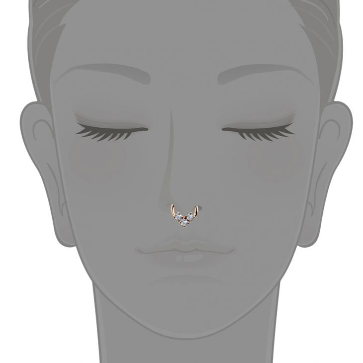 14K rose gold CZ clicker ring illustrated as a septum piercing on a neutral face diagram