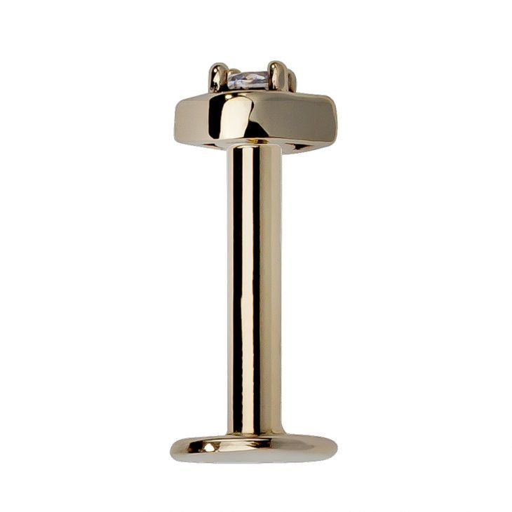 14K yellow gold flat back labret post assembled, showing barbell length, disc base, and eye-shaped top