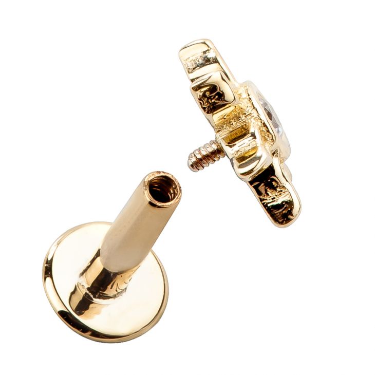 14K yellow gold sunburst labret stud separated to show internally threaded post and flat back disc