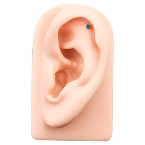 2mm teal blue diamond bezel labret shown in helix cartilage piercing on silicone ear model