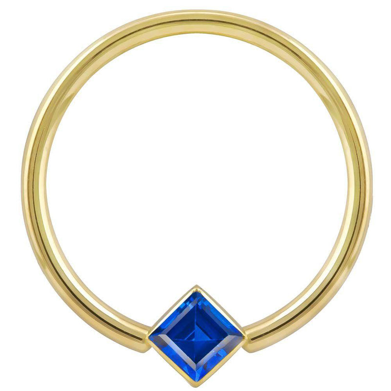 14k yellow gold fixed bead ring with blue princess-cut CZ in corner bezel mount, front view