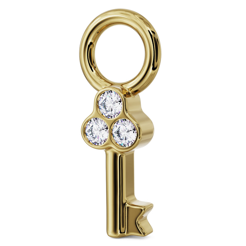Angled side view of 14K yellow gold key charm showing depth of bezel diamond setting