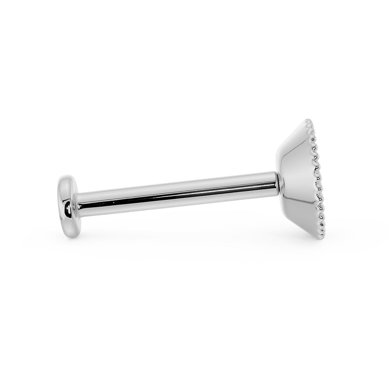 Side profile of white gold milgrain flat back labret showing post length and flat disc backing