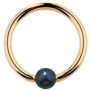 14K yellow gold captive bead ring with iridescent peacock pearl, front view