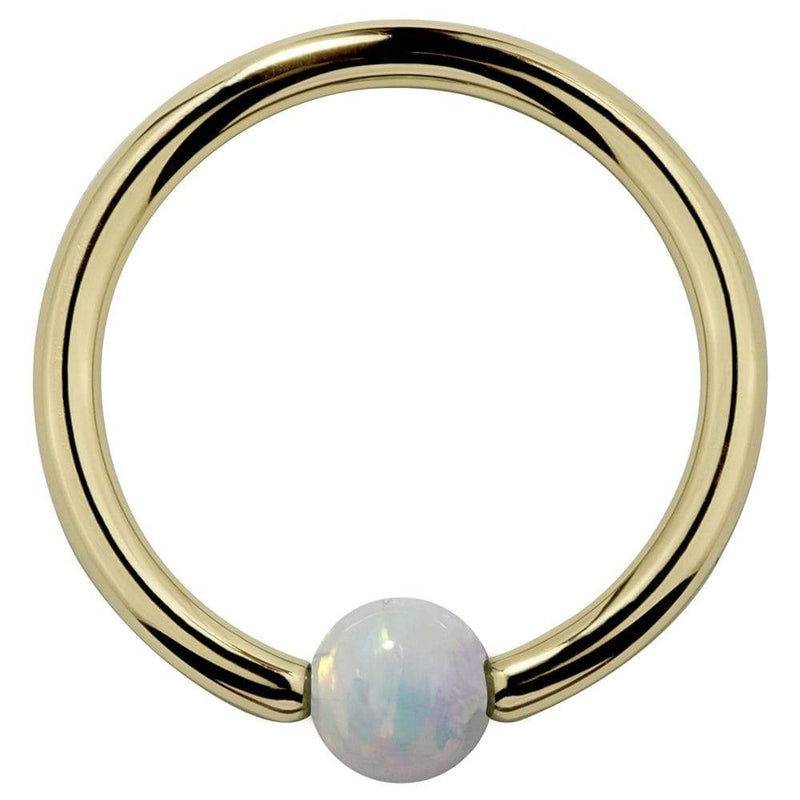 14K yellow gold captive bead ring with white opal ball, front view on white background