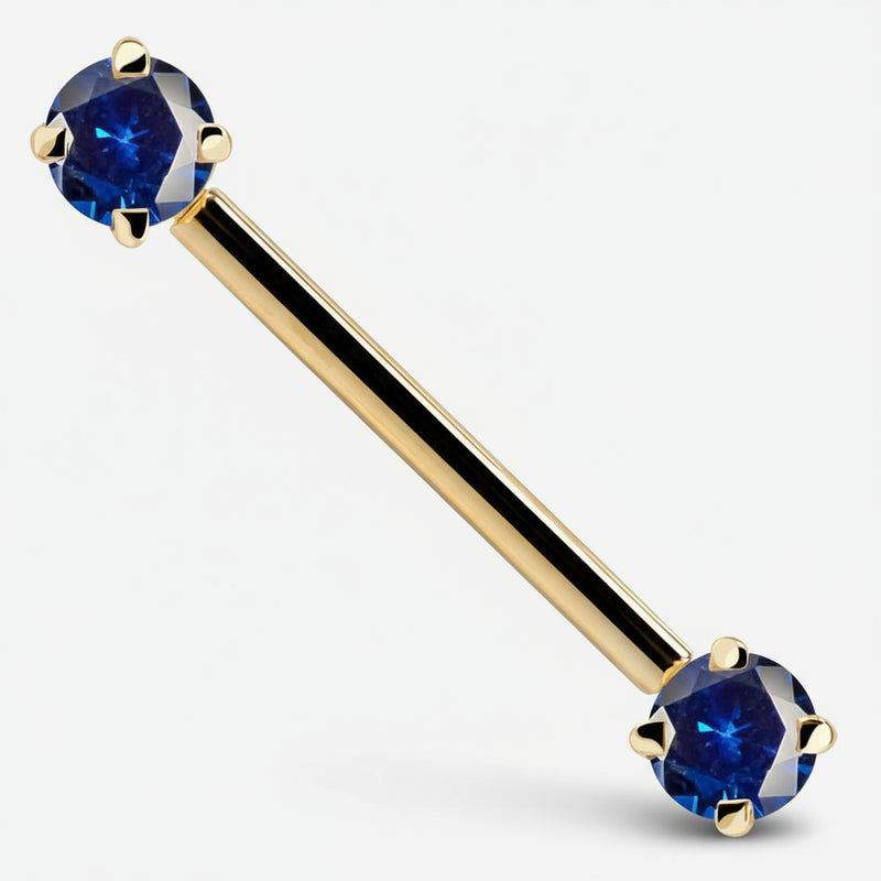 14k yellow gold straight barbell with dual blue CZ prong-set ends, angled product view