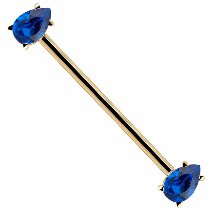 14k yellow gold industrial barbell with dual blue teardrop CZ gems in prong settings, diagonal view