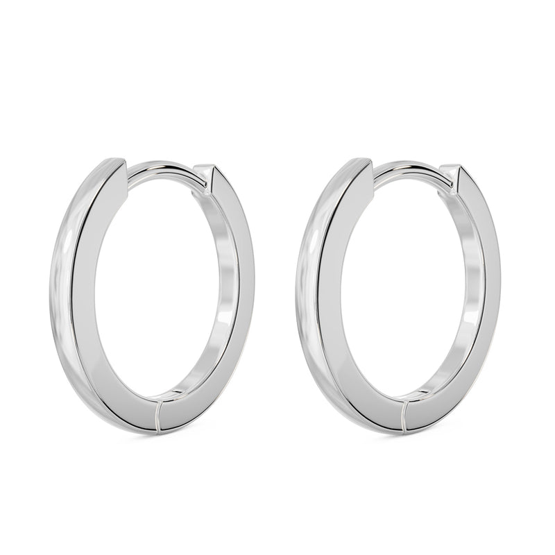 14k white gold huggie hoop earrings, pair shown at an angle with high-polish silver-tone finish