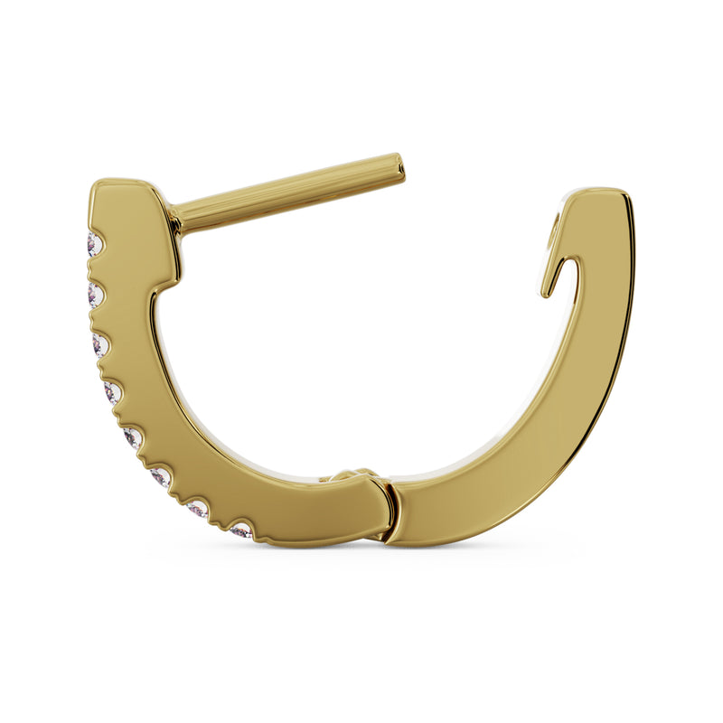 Reverse side profile of single 14k yellow gold diamond huggie hoop showing smooth inner band and clasp
