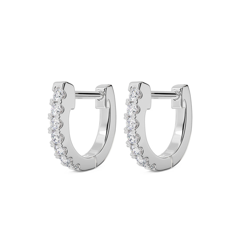 Pair of 14k white gold 8mm diamond huggie hoop earrings, angled front view showing prong-set diamonds