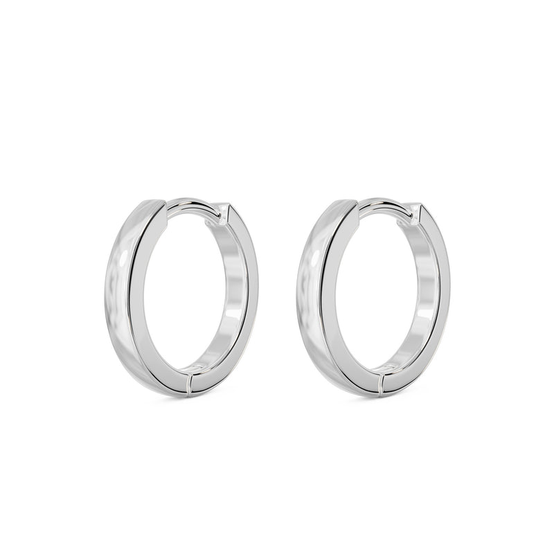 Matched pair of 14k white gold 8mm huggie hoop earrings, angled view showing bright silver tone