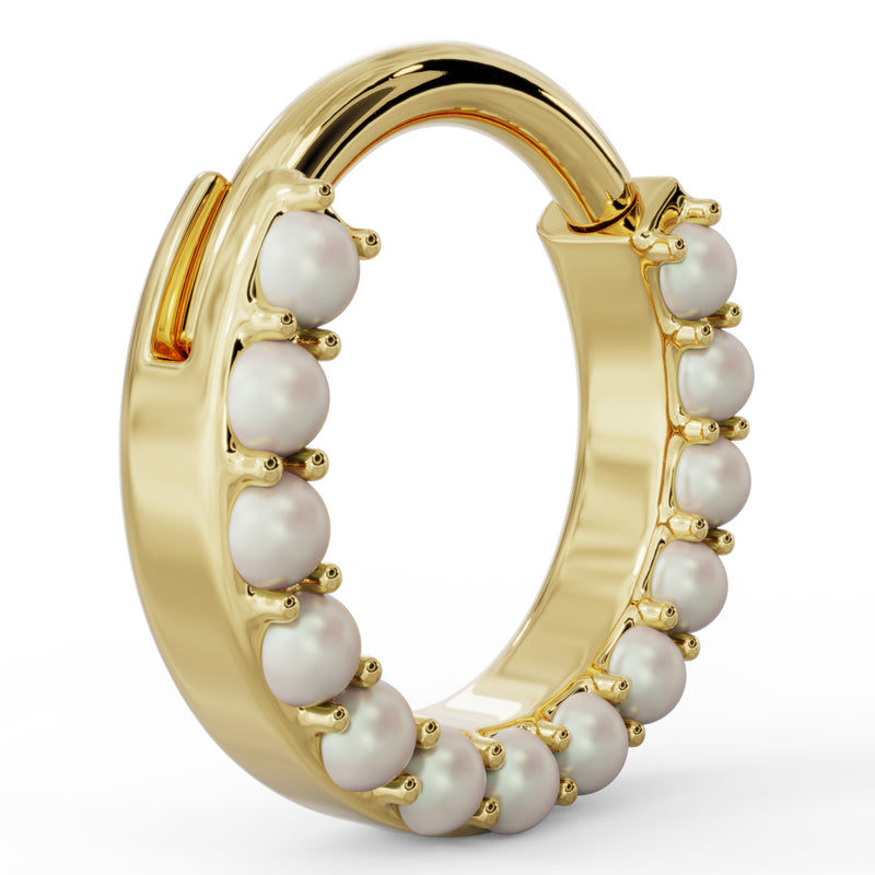 Angled side view of 14k yellow gold pearl clicker hoop showing ring depth and pearl setting profile