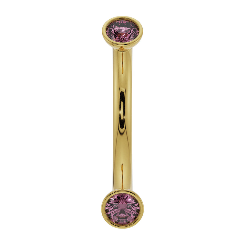 14K yellow gold curved barbell with dual bezel-set pink sapphires, front view