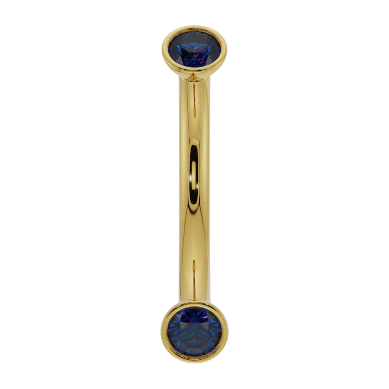 14k yellow gold curved barbell with dual bezel-set blue sapphires, front view