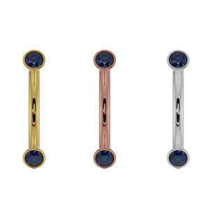 Blue sapphire bezel curved barbell shown in all three metal options: yellow, rose, and white gold