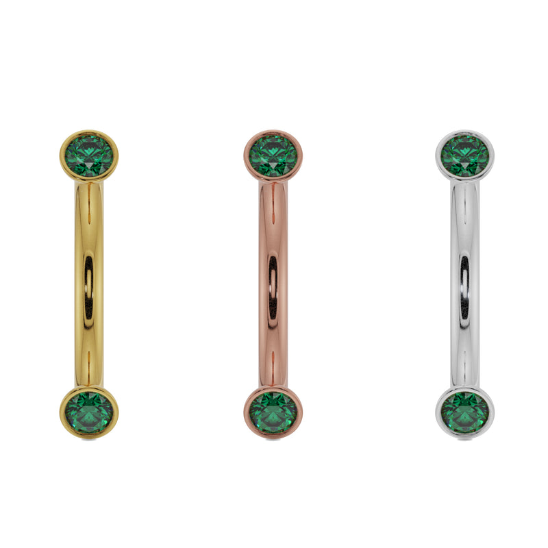 Emerald bezel curved barbell in all three metal options: 14k yellow, rose, and white gold side by side