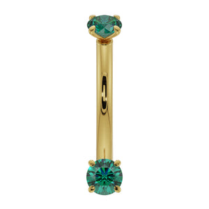 14K yellow gold dainty emerald curved barbell with dual prong-set round emeralds, front view