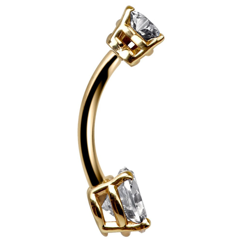 Side profile of 14k yellow gold belly ring showing curved barbell and clear CZ heart prong detail