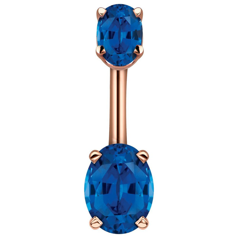 14k rose gold belly ring with dual deep blue oval CZ stones in four-prong settings, front view