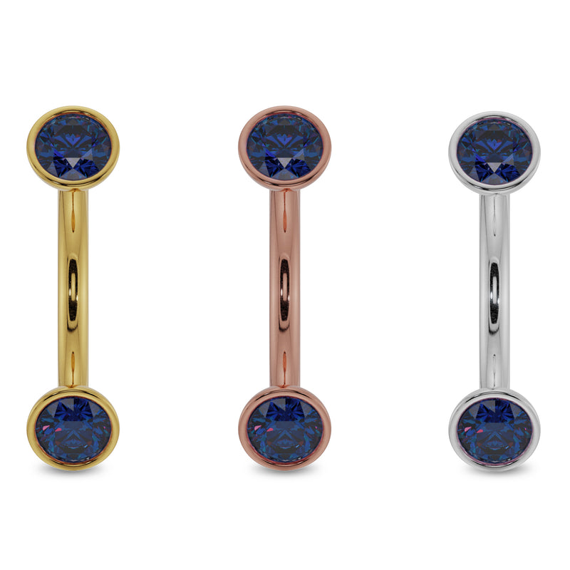 Blue sapphire bezel-set curved barbell in all three 14k gold colors: yellow, rose, and white gold