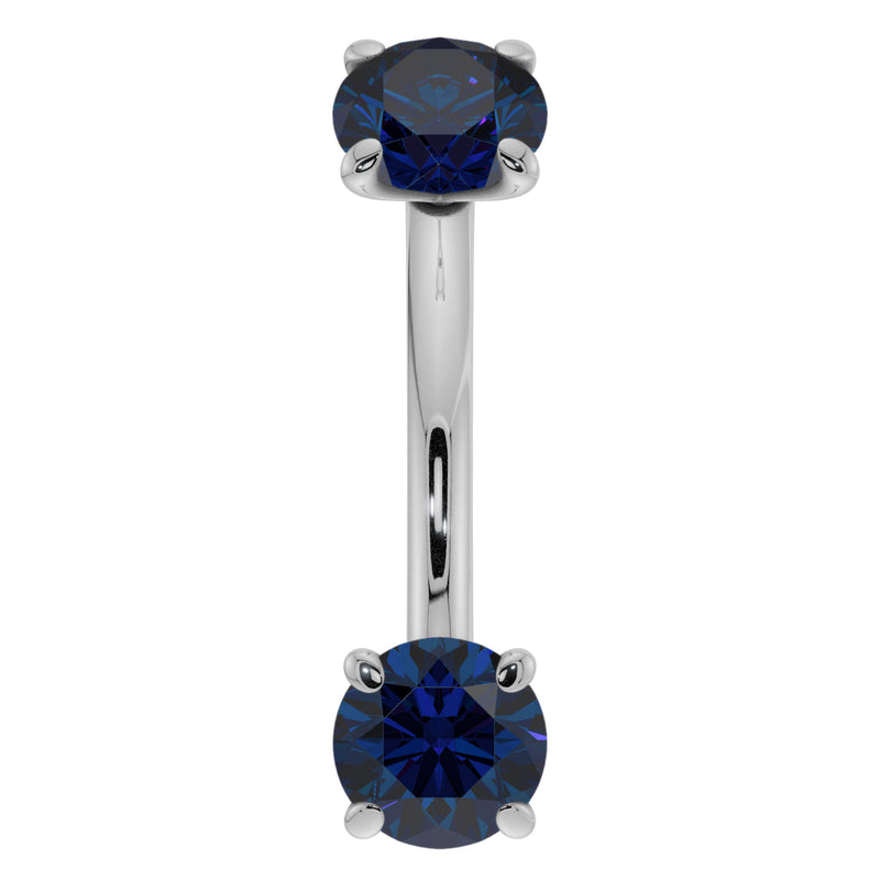 14K white gold 14G blue sapphire curved barbell, front view showing larger prong-set sapphire ends