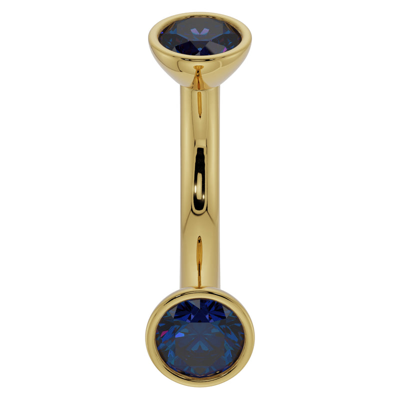 14k yellow gold 14G curved barbell with larger 4mm bezel-set blue sapphires for belly ring use