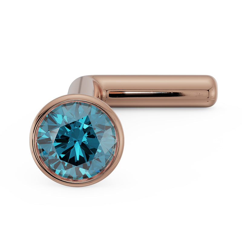 14k rose gold blue diamond L post nose stud, angled view contrasting warm gold with teal diamond