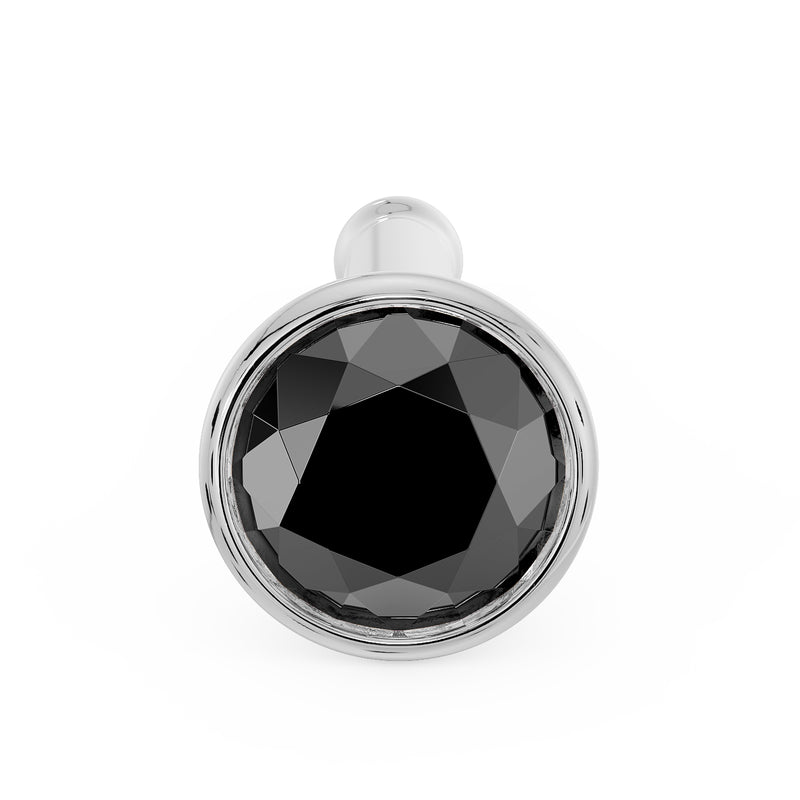 Front-facing close-up of 2.5mm black diamond bezel nose bone stud in white gold