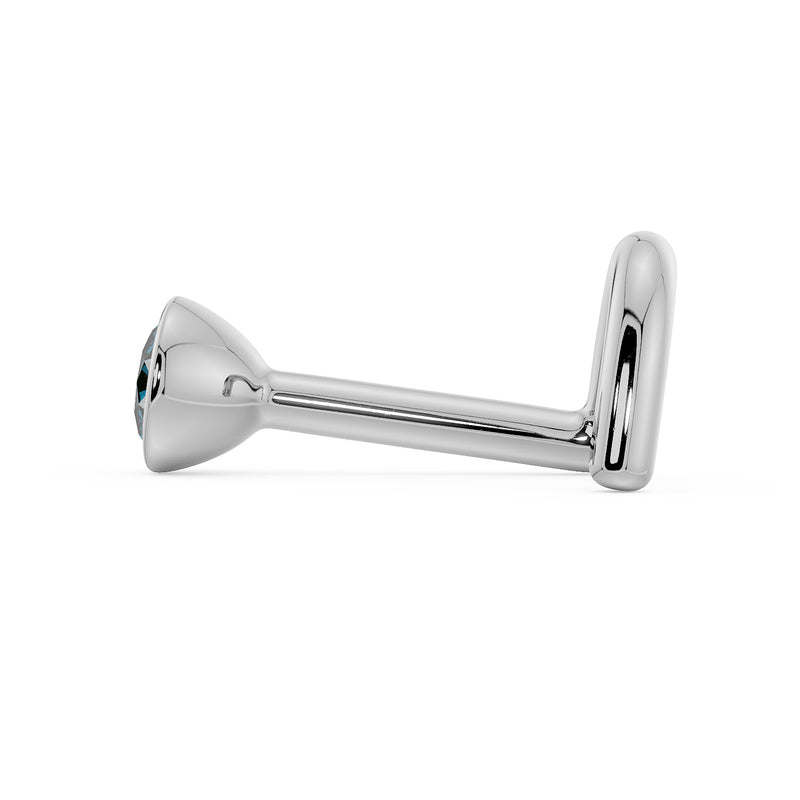 Side profile of white gold blue diamond bezel nose stud showing straight post and bone end