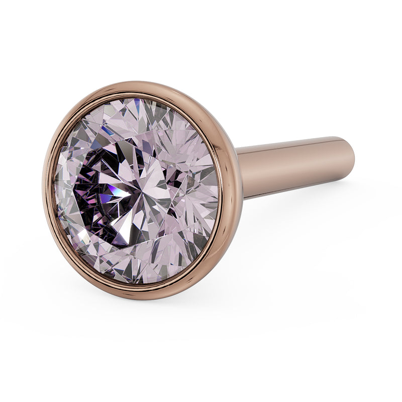 Angled close-up of 3mm pink diamond in 14k rose gold bezel nose stud, straight post visible