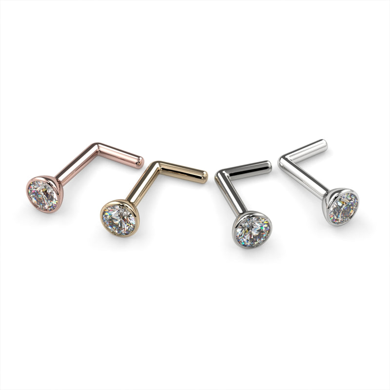 Diamond bezel nose ring L post style in rose gold, yellow gold, white gold, and platinum side by side