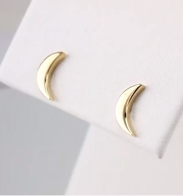 14k yellow gold crescent moon stud earrings on white display showing polished mirror-finish detail