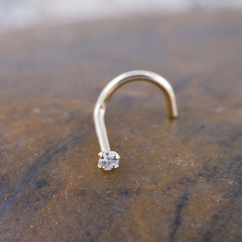 14k yellow gold CZ nose screw on stone surface showing full twist post length