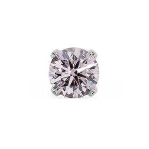 Close-up of 2mm pink diamond in four-prong white gold setting, showing faceted brilliance