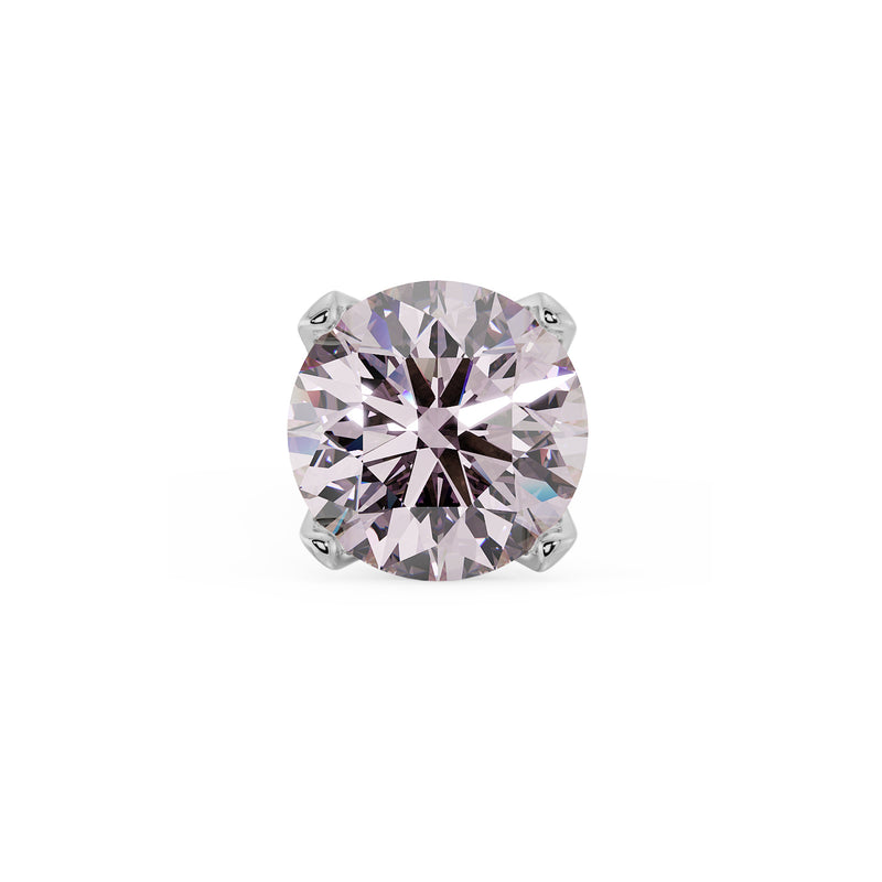 Close-up of 2mm pink diamond in four-prong white gold setting, showing faceted brilliance