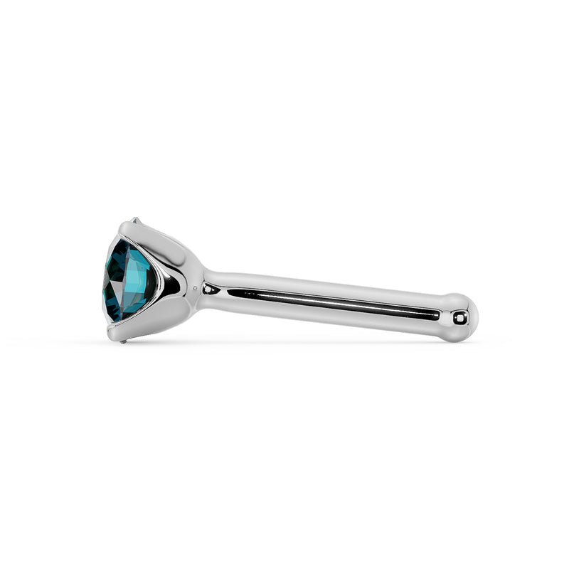 Side profile of 14k white gold blue diamond bone nose stud showing low-set prong and post tip