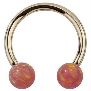 14k yellow gold circular barbell with pink opal balls, front view showing iridescent swirl detail