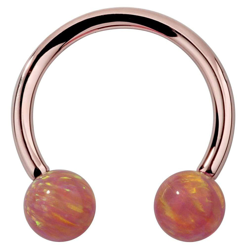 14k rose gold circular barbell with pink opal ball ends, front view highlighting warm rosy tone