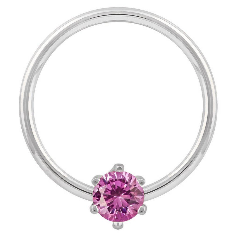 14k white gold fixed bead captive ring with pink CZ, polished band and prong detail visible