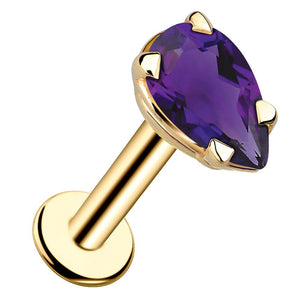 14k yellow gold pear-cut amethyst flat back labret stud, angled view showing prong setting and disc