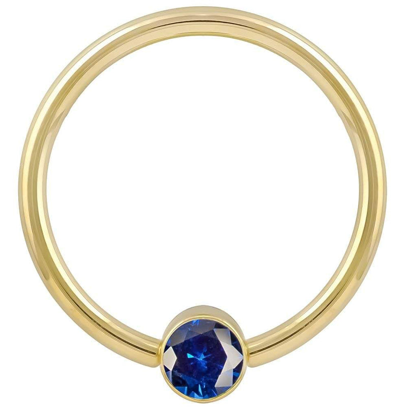 14k yellow gold blue cubic zirconia bezel fixed bead ring, straight-on front view showing polished hoop