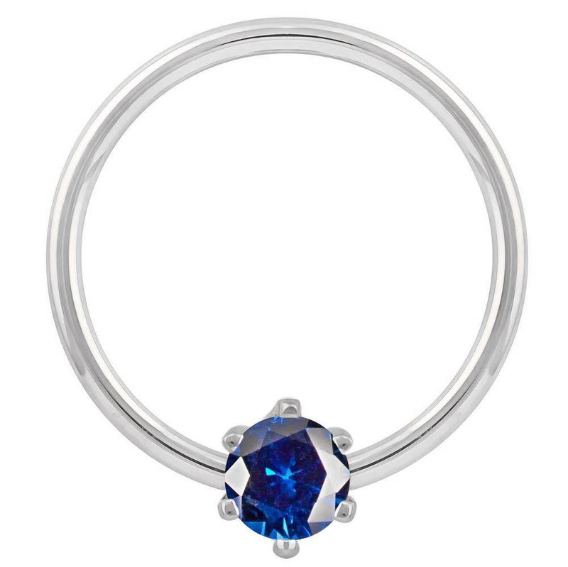 14k white gold fixed bead ring with blue CZ prong setting, polished hoop detail visible